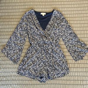 Navy floral romper with bell sleeve